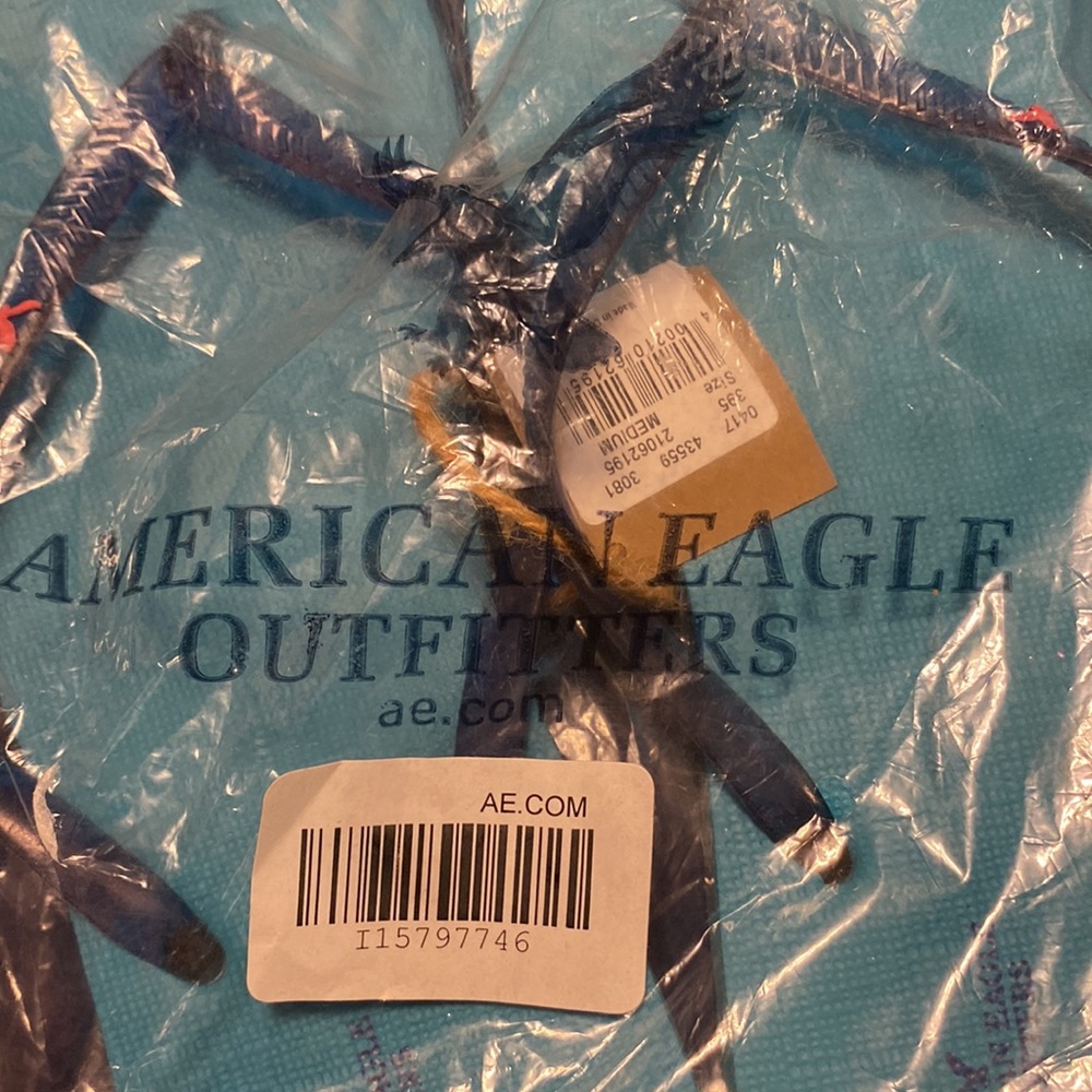 NWT American Eagle women’s flip flops size M in sealed unopened bag AE logo